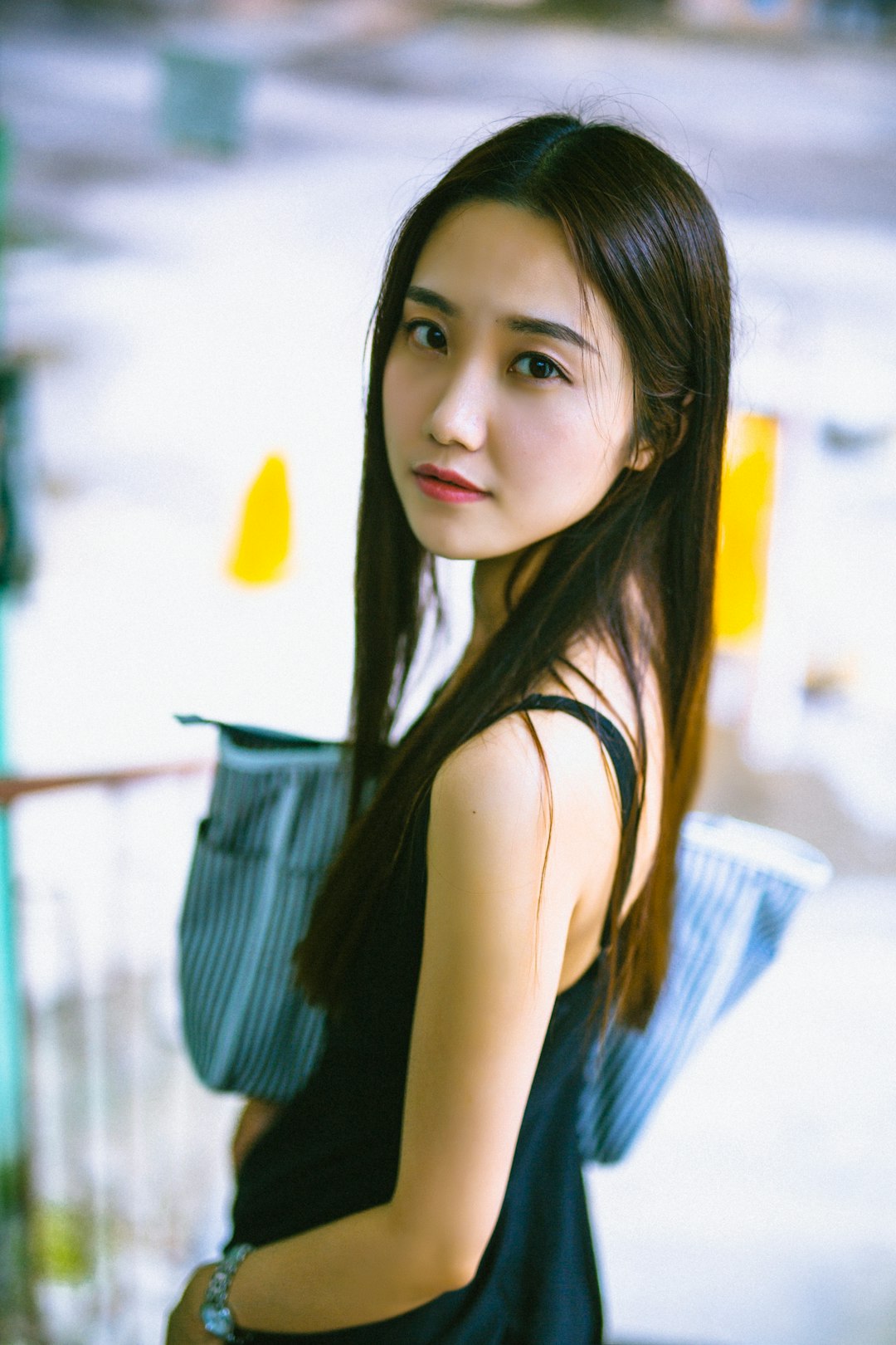 woman-in-black-sleeveless-top-y1-g34foiic